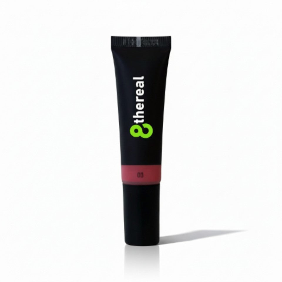 8thereal Soft Flush Liquid Blush in a sleek black squeeze tube with a natural rosy shade for a radiant cheek glow.