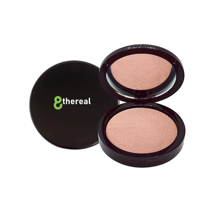 8thereal Soft-Focus Luminizing Powder in a sleek black compact with a mirror, showing a silky, radiant peach shade.