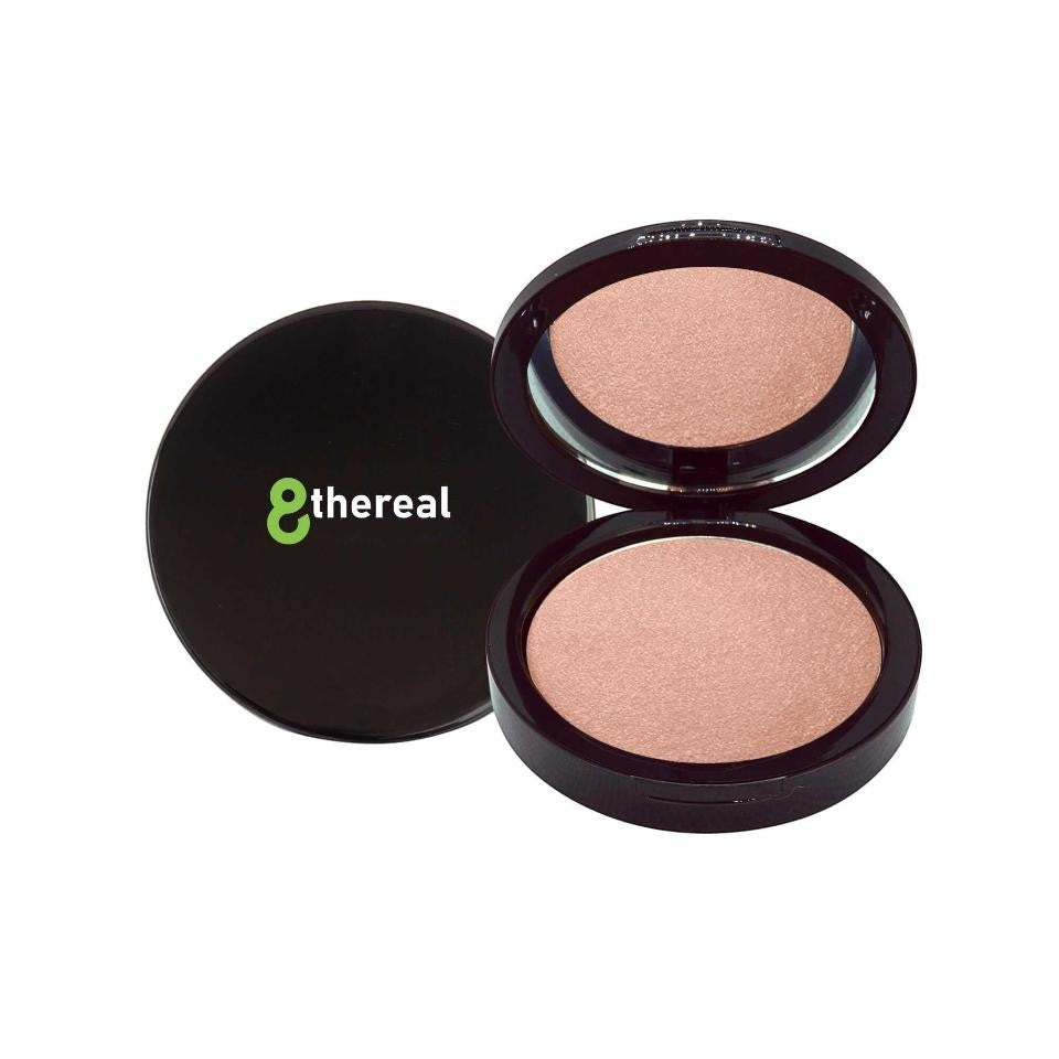 8thereal Soft-Focus Luminizing Powder in a sleek black compact with a shimmering champagne-toned setting powder.