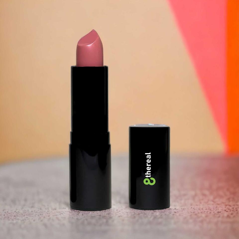 8thereal luxury cream lipstick in a soft mauve shade with a satin finish, presented in sleek black packaging.