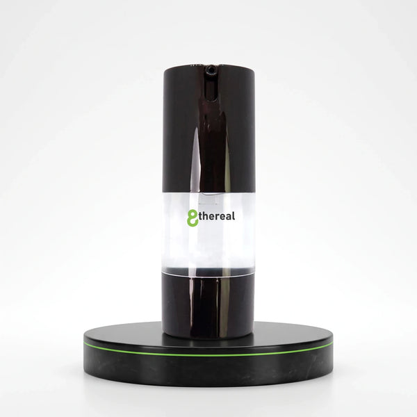 8thereal Oil-Control Matte Face Primer in a sleek black pump bottle on a matching circular display stand.