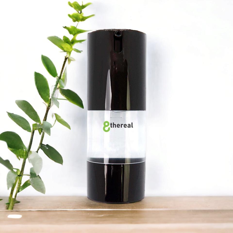 8thereal oil-control matte face primer in a sleek black pump bottle on a wooden surface with a green plant.