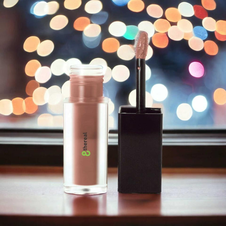 8thereal matte lip stain in a neutral shade with a doe-foot applicator, featuring a clear bottle and black cap.