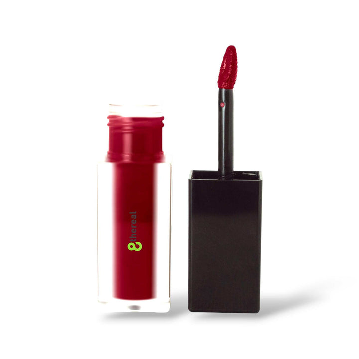 8thereal matte lip stain in a bold red shade with a doe-foot applicator, featuring a clear bottle and black cap.
