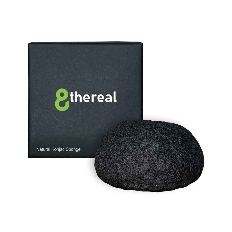 8thereal natural black konjac root fiber cleansing sponge next to its branded black product box