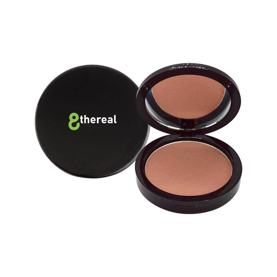 8thereal Natural Warmth Bronzer in a black compact with mirror, featuring silky, buildable powder for a radiant glow.
