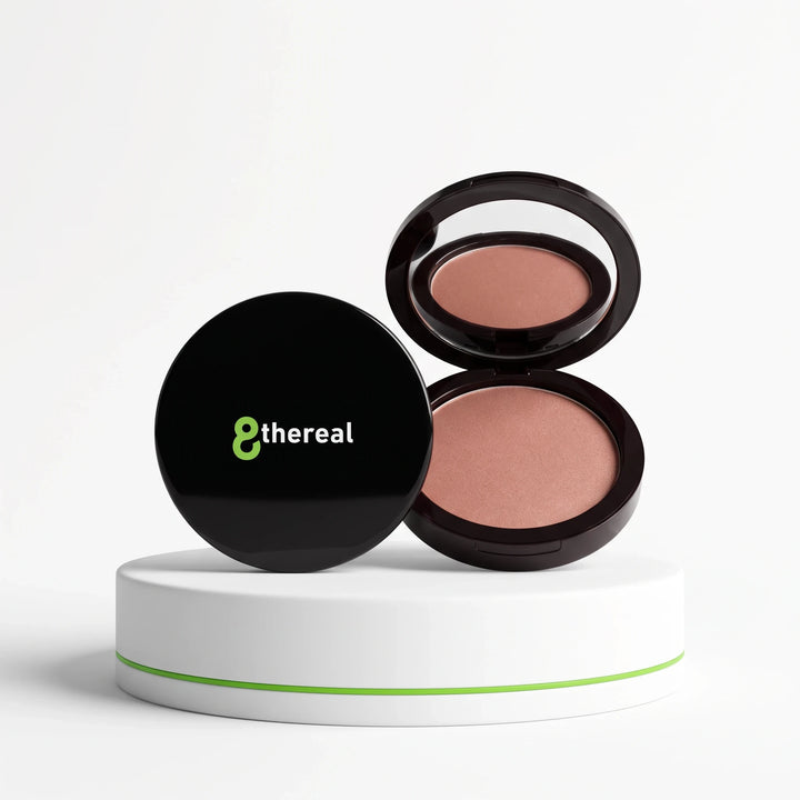 8thereal Natural Warmth Bronzer in a sleek black compact with mirror, displayed on a white pedestal.