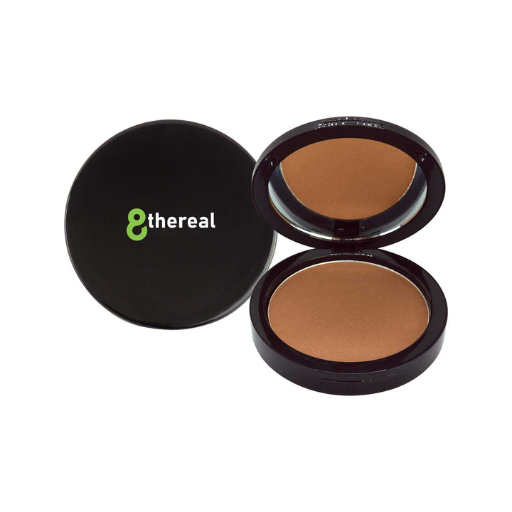8thereal Natural Warmth Bronzer in a sleek black compact with an open lid showing the pressed powder and mirror.