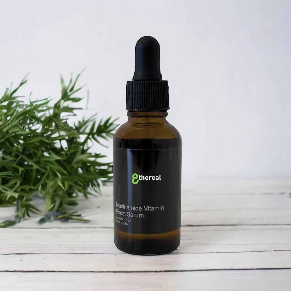 8thereal Niacinamide Vitamin Boost Serum in a brown glass dropper bottle on a white wooden surface with greenery.