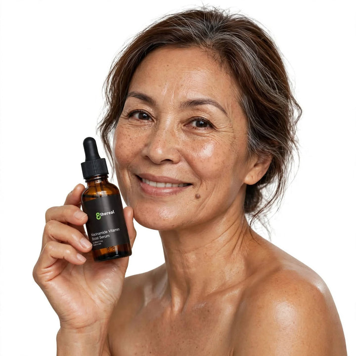 A smiling woman holding an 8thereal Niacinamide Vitamin Boost Serum bottle in a clean, professional studio setting.