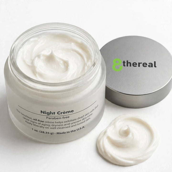 8thereal Night Skin Renewal Crème in a glass jar with a silver lid and a swirl of rich white moisturizer beside it.
