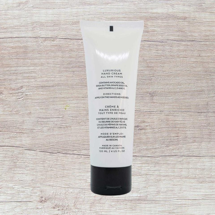 8thereal Restorative Nourish Hand Cream in a white squeeze tube with black cap, featuring avocado oil and shea butter.