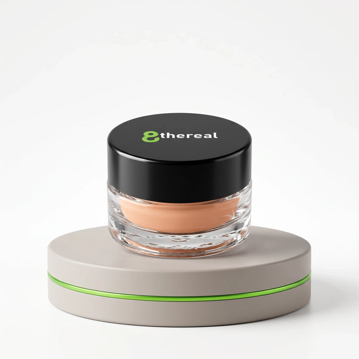 8thereal Smoothing Eye & Lip Primer in a glass jar with a black lid, sitting on a neutral display pedestal.