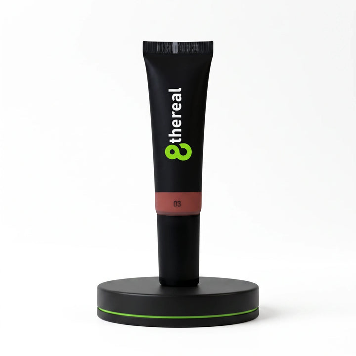 8thereal Soft Flush liquid blush in shade 03, a creamy hydrating formula in a black squeeze tube on a display stand.