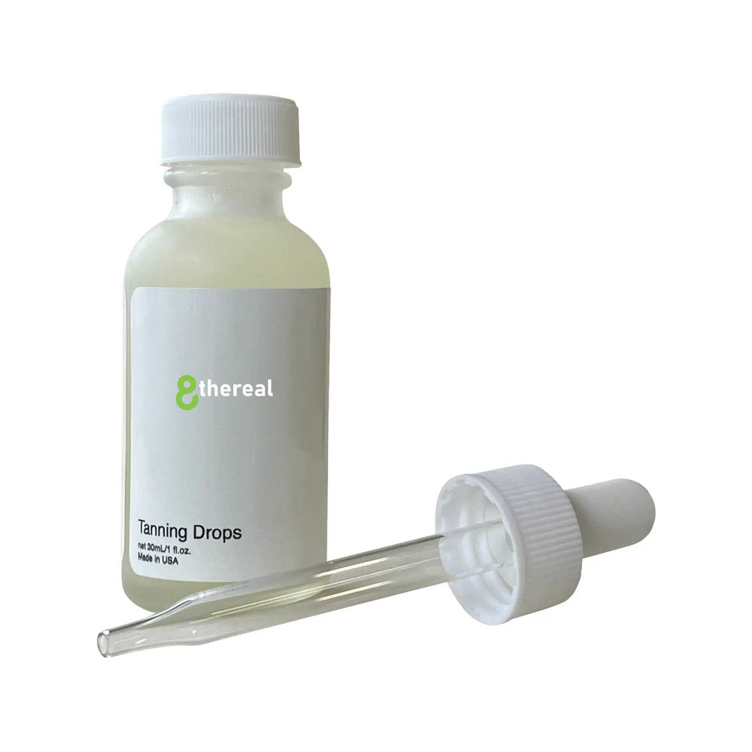 8thereal Sunlit Glow Tanning Drops in a clear glass bottle with a white dropper cap for customizable sunless tanning.