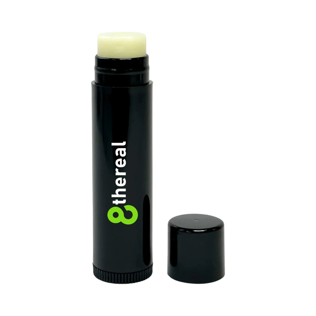 8thereal vegan lip balm in a black twist-up tube with the cap removed, showing the unscented nourishing balm stick.