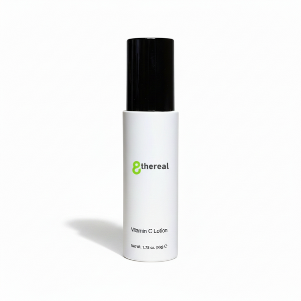 White lotion bottle with black cap on a white background